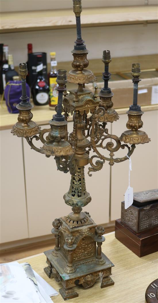 A Victorian gilt metal candelabrum now converted to a table lamp H.72cm.